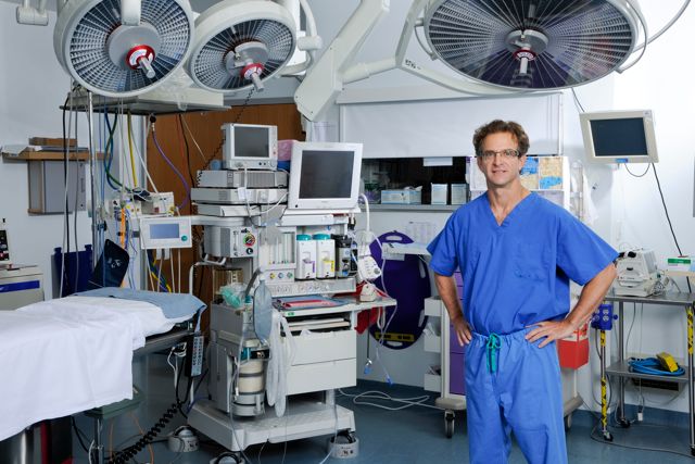 Dr Yunis standing in operating room