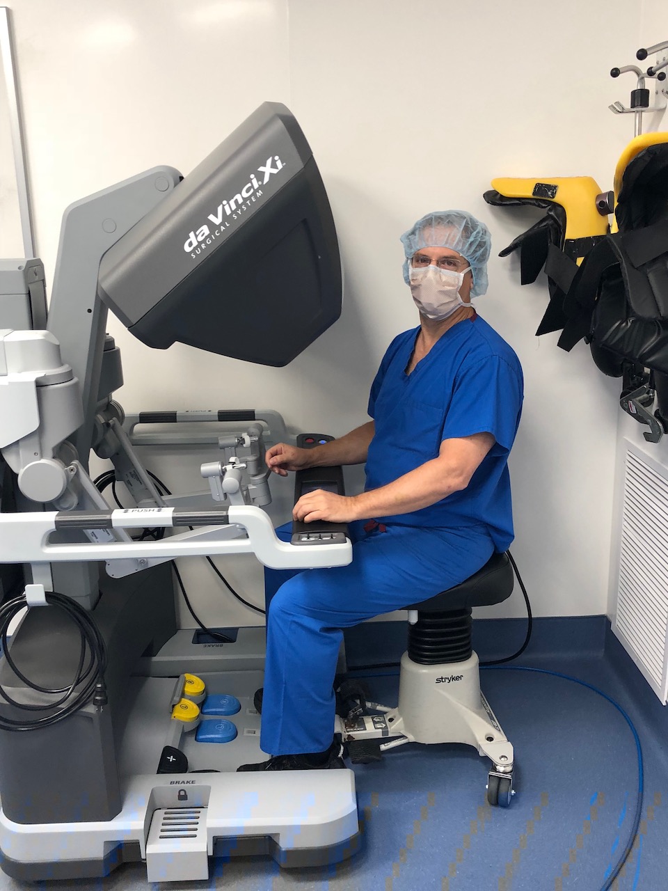 Dr. Yunis sitting at machine for hernia repair